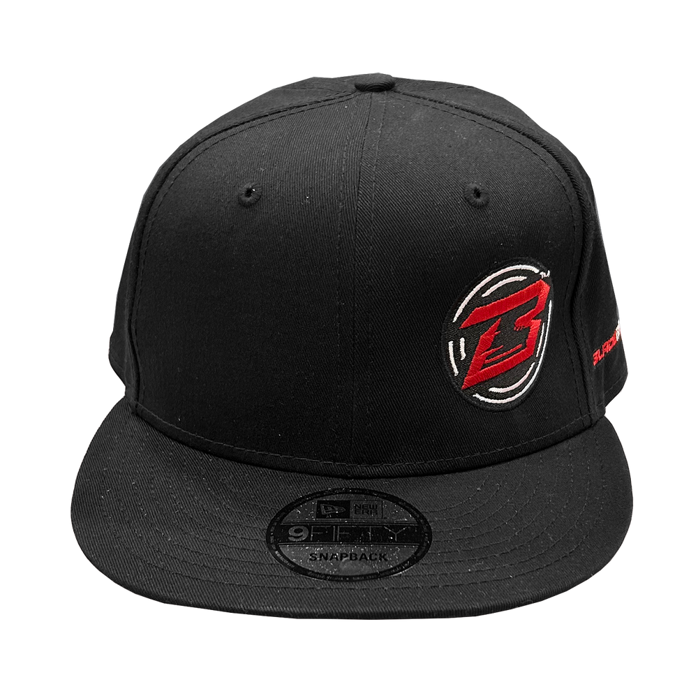 Black snapback cap with a logo on a white background