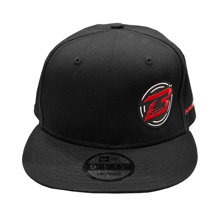 Black snapback cap with a logo on a white background