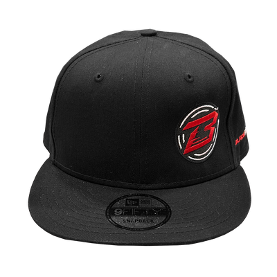 Black snapback cap with a logo on a white background